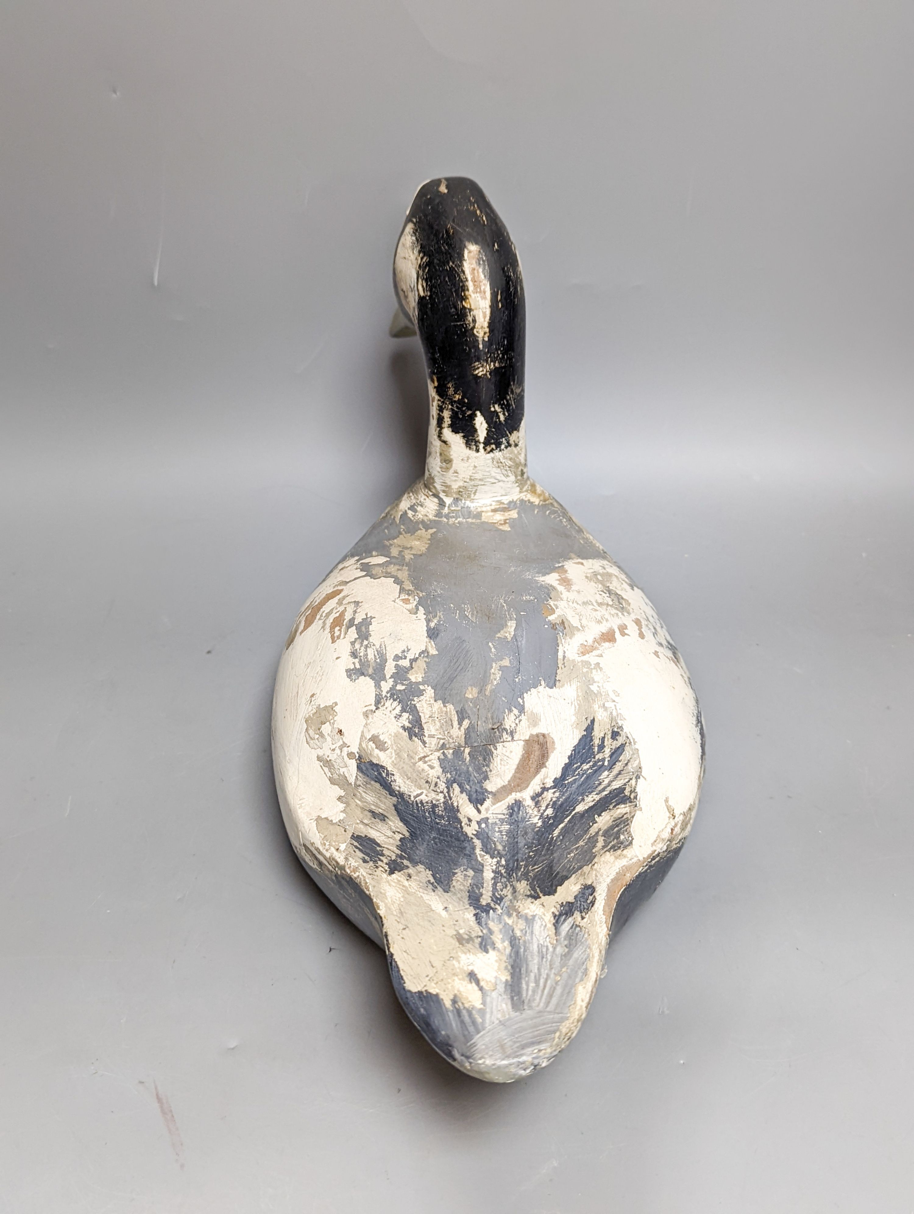 A modern painted decoy duck and a 20th century Chinese ceramic model duck (2) 42cm